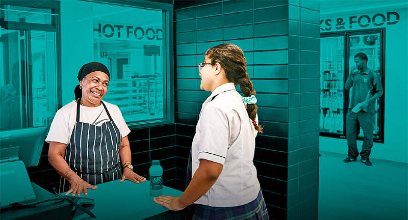 School employee serving student.